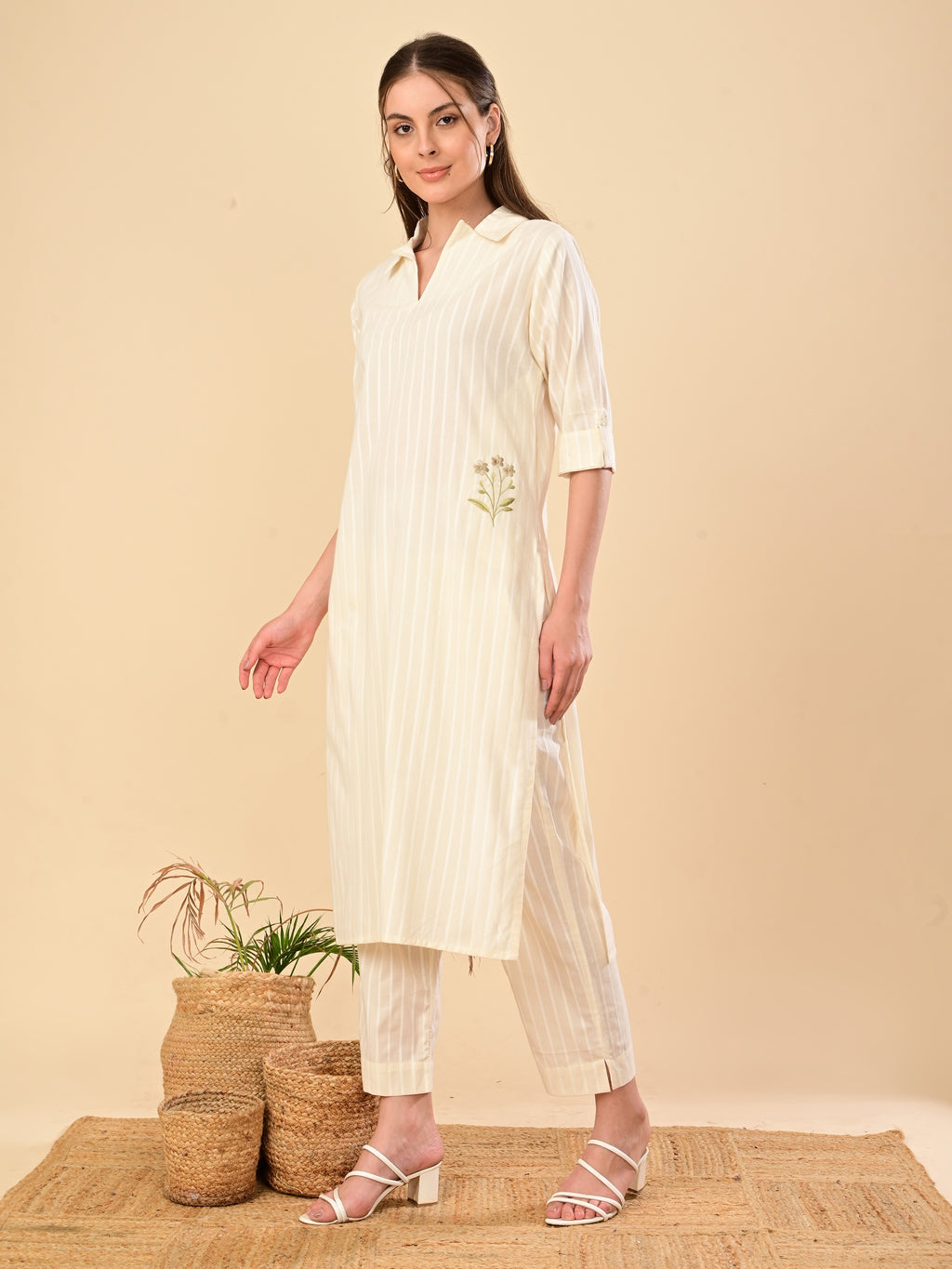 A fluid ivory Co-ord set with fine stripes and a gentle embroidery