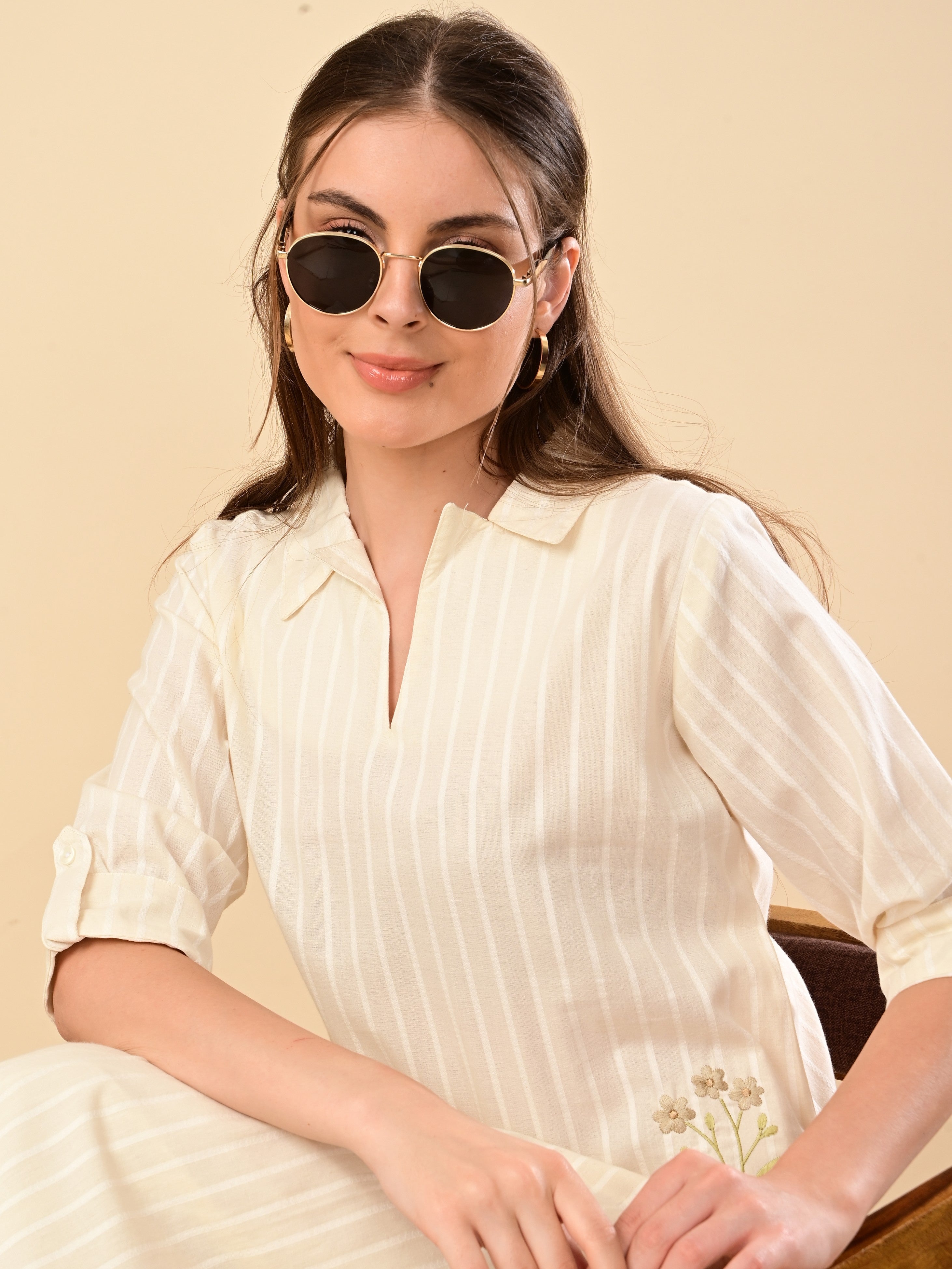 A fluid ivory Co-ord set with fine stripes and a gentle embroidery